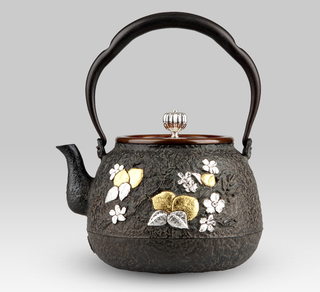 Iron Kettle Peach of immortality in Chinese mythology and Buddha's hand orange with silver lid handle