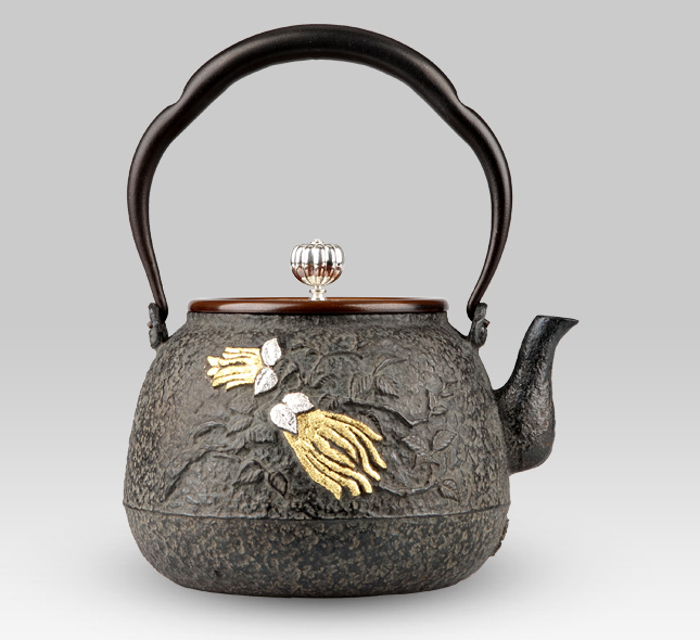 Iron Kettle Peach of immortality in Chinese mythology and Buddha's hand orange with silver lid handle